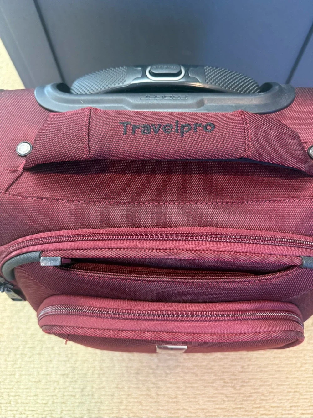 TravelPro Red Carry-On Spinner Bag Luggage